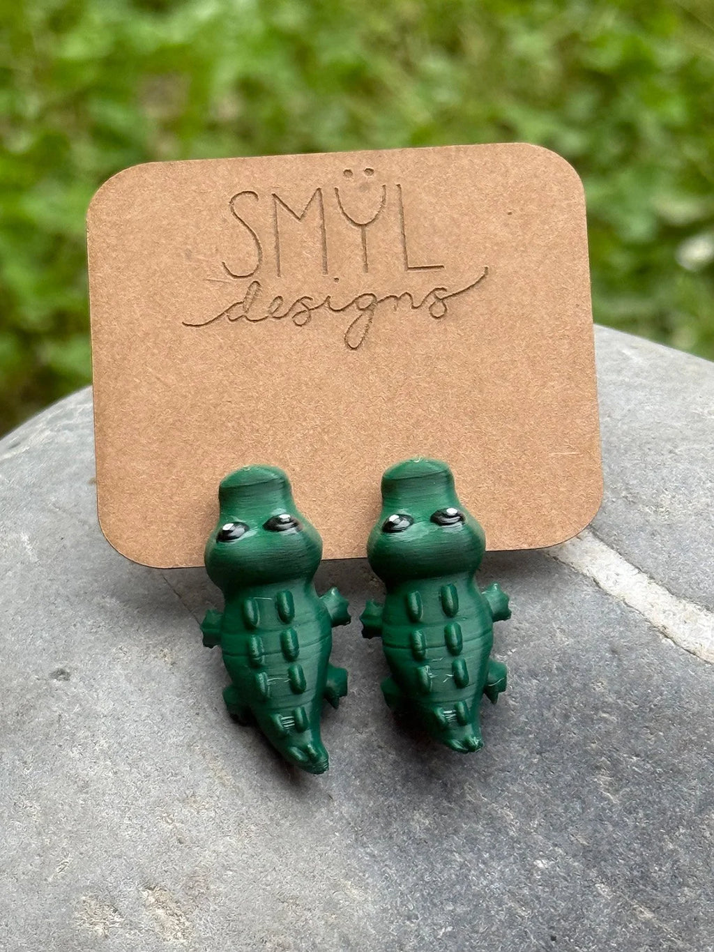 Green 3D-printed chomping alligator earrings by SMYL Designs