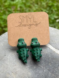 Green 3D-printed chomping alligator earrings by SMYL Designs