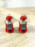 Red 3D-printed gumball machine earrings with shakeable beads