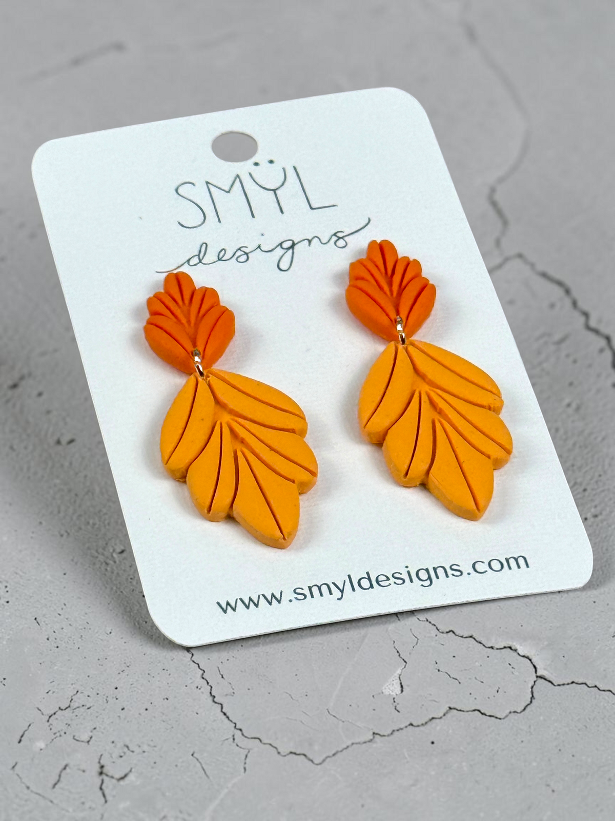 Orange botanical leaf dangle earrings by SMYL Designs