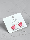 Metallic pink asymmetrical heart stud earrings by SMYL Designs