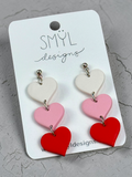 White, pink, and red trio-of-hearts dangle earrings
