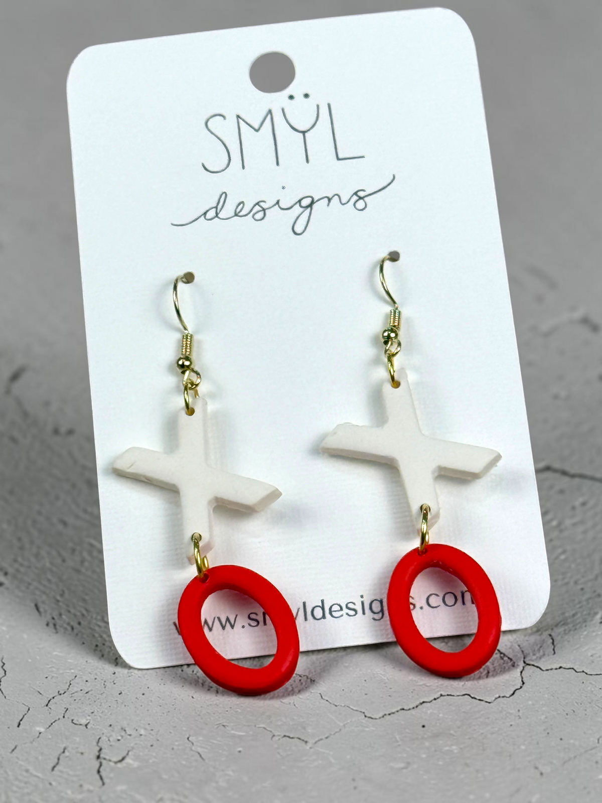 White X and red O dangle earrings
