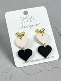 Black and white heart dangle earrings with gold bow studs