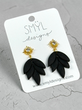 Black lotus-petal dangle earrings with gold flower studs
