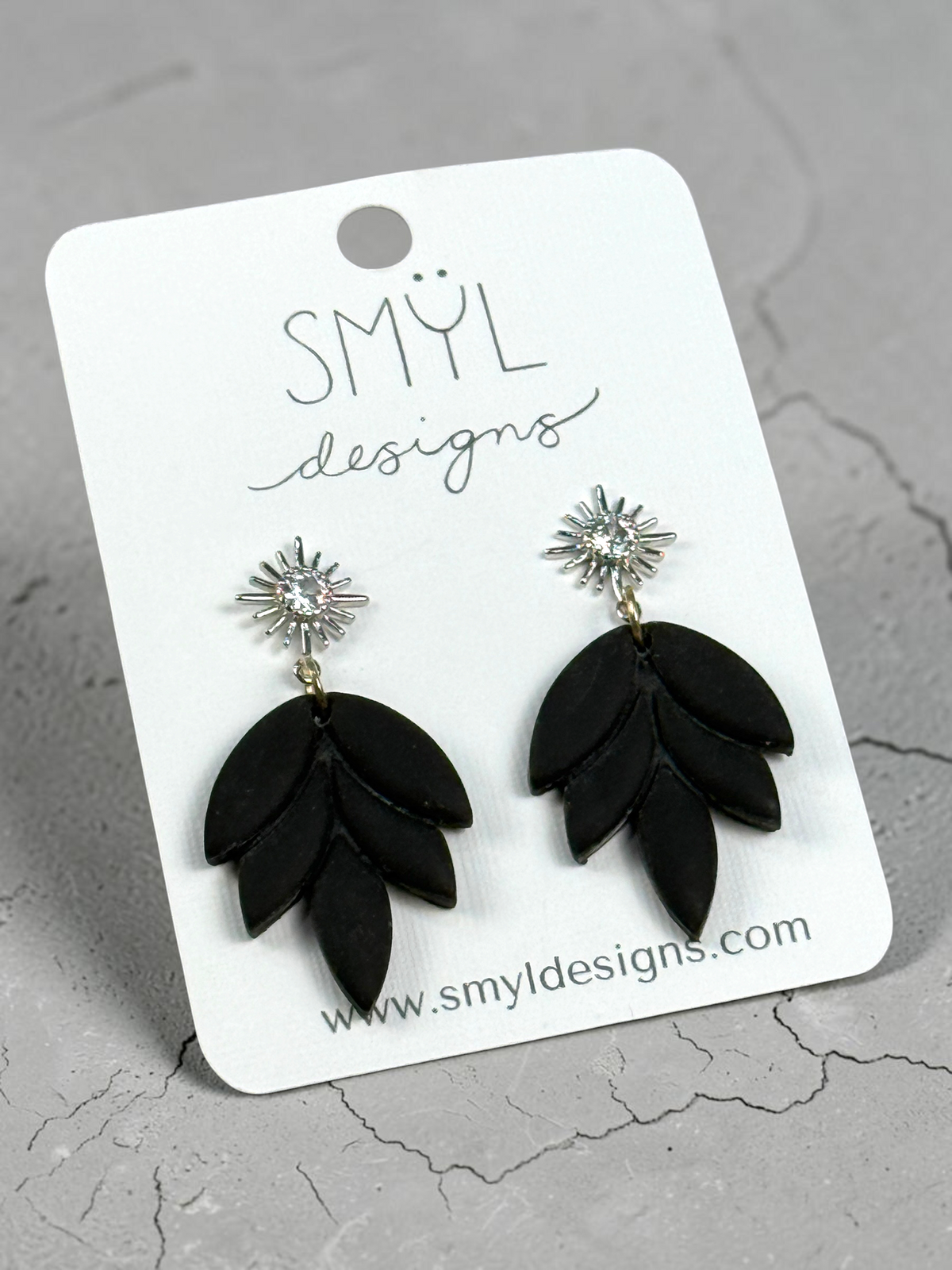 Black lotus-petal dangle earrings with silver flower studs