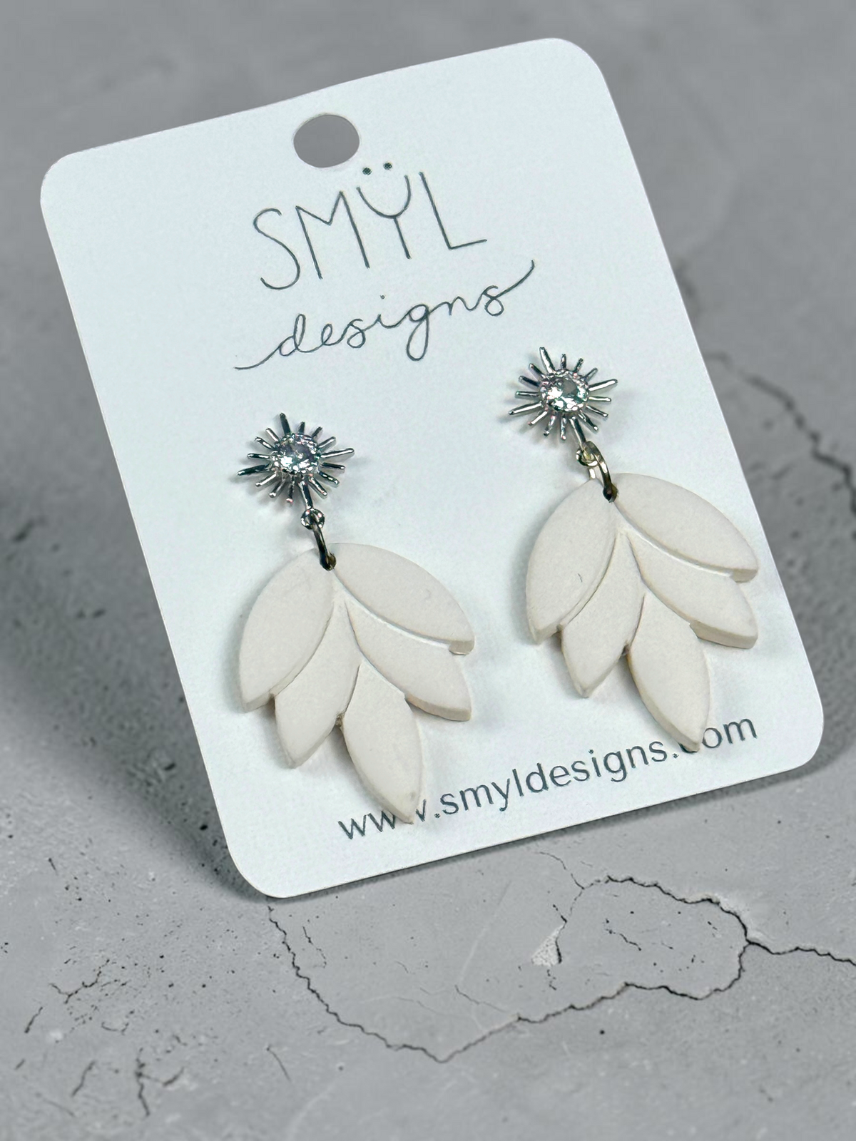 White lotus-petal dangle earrings with silver flower studs