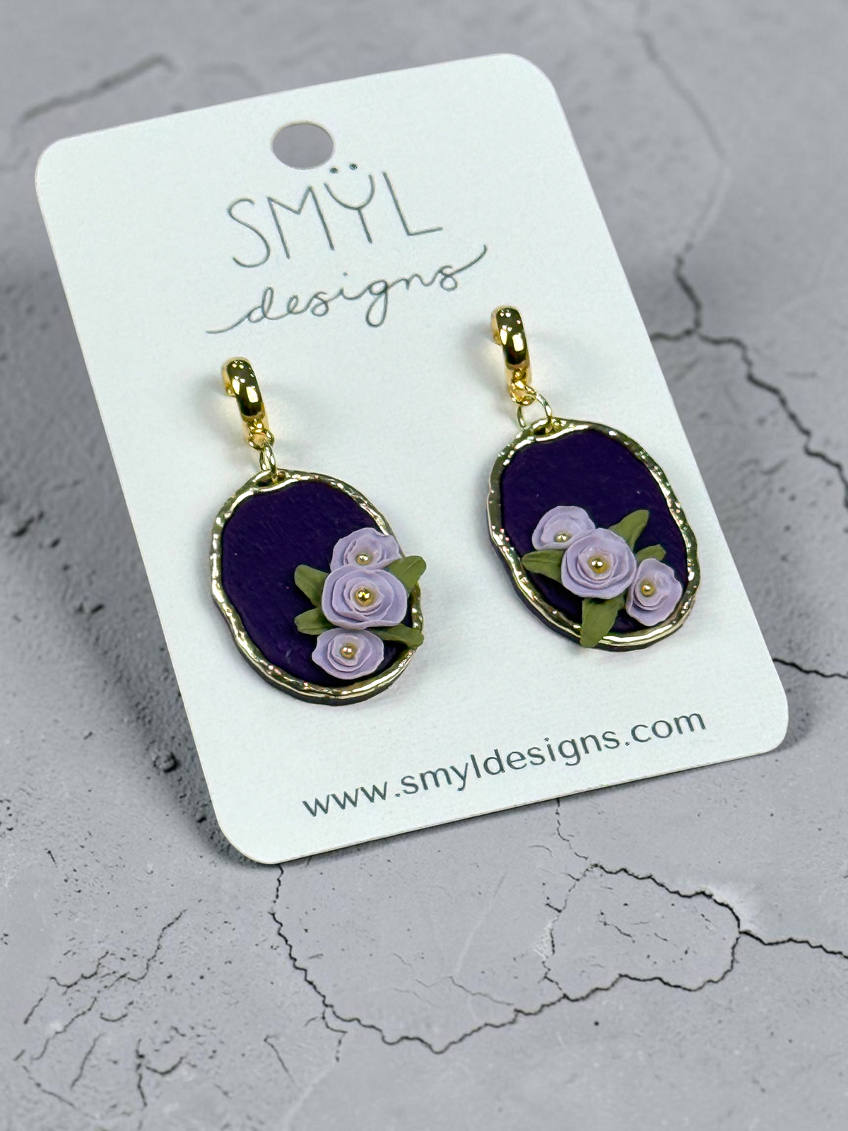 Purple oval dangle earrings with lavender flowers and gold-tone accents by SMYL Designs