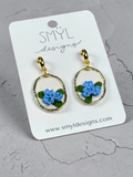 Gold-tone hoop dangle earrings with blue flowers by SMYL Designs