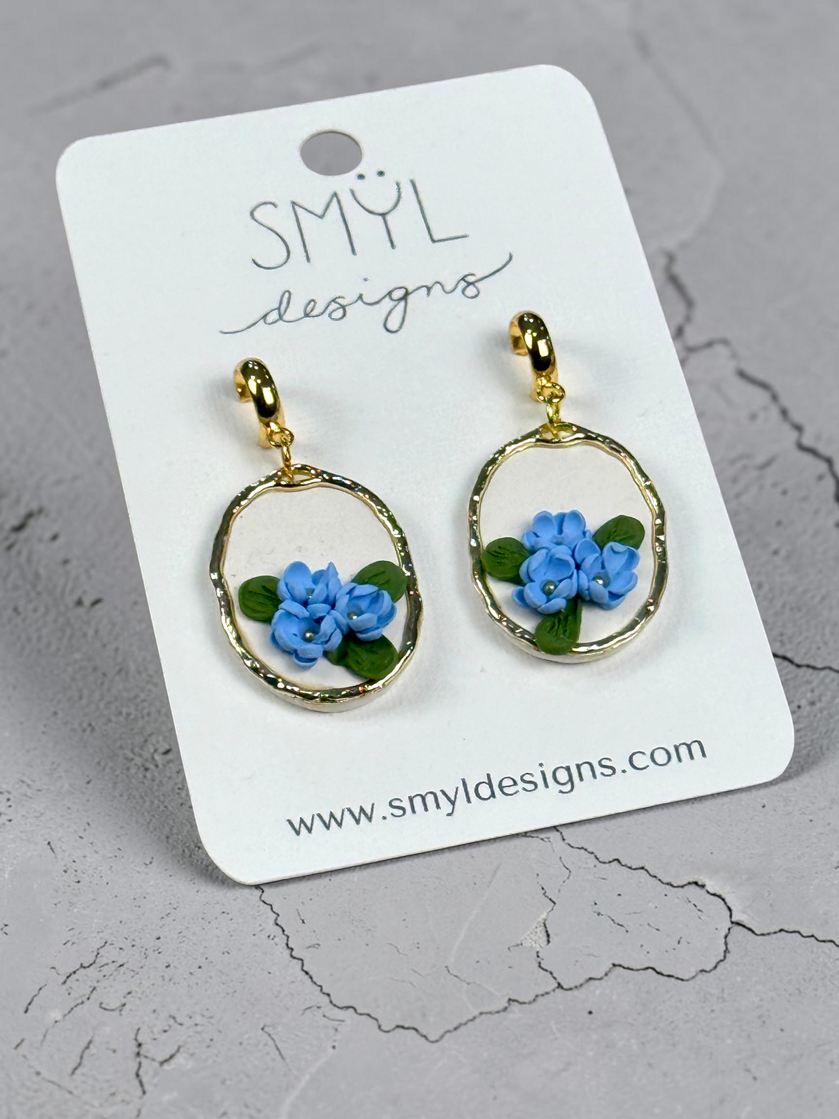 Gold-tone hoop dangle earrings with blue flowers by SMYL Designs