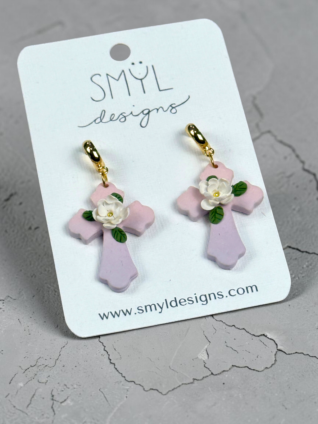 Alternate view of pink floral cross dangle earrings with white flowers by SMYL Designs
