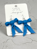 Blue bow dangle earrings by SMYL Designs