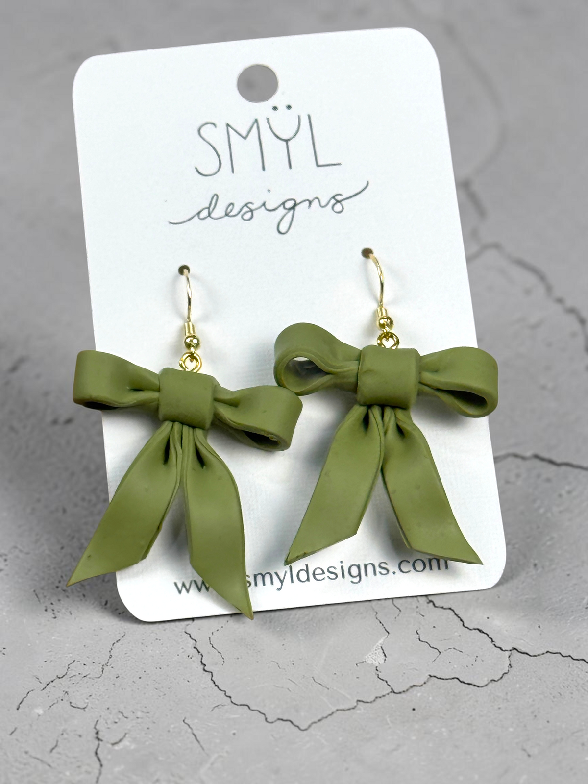 Sage green bow dangle earrings by SMYL Designs