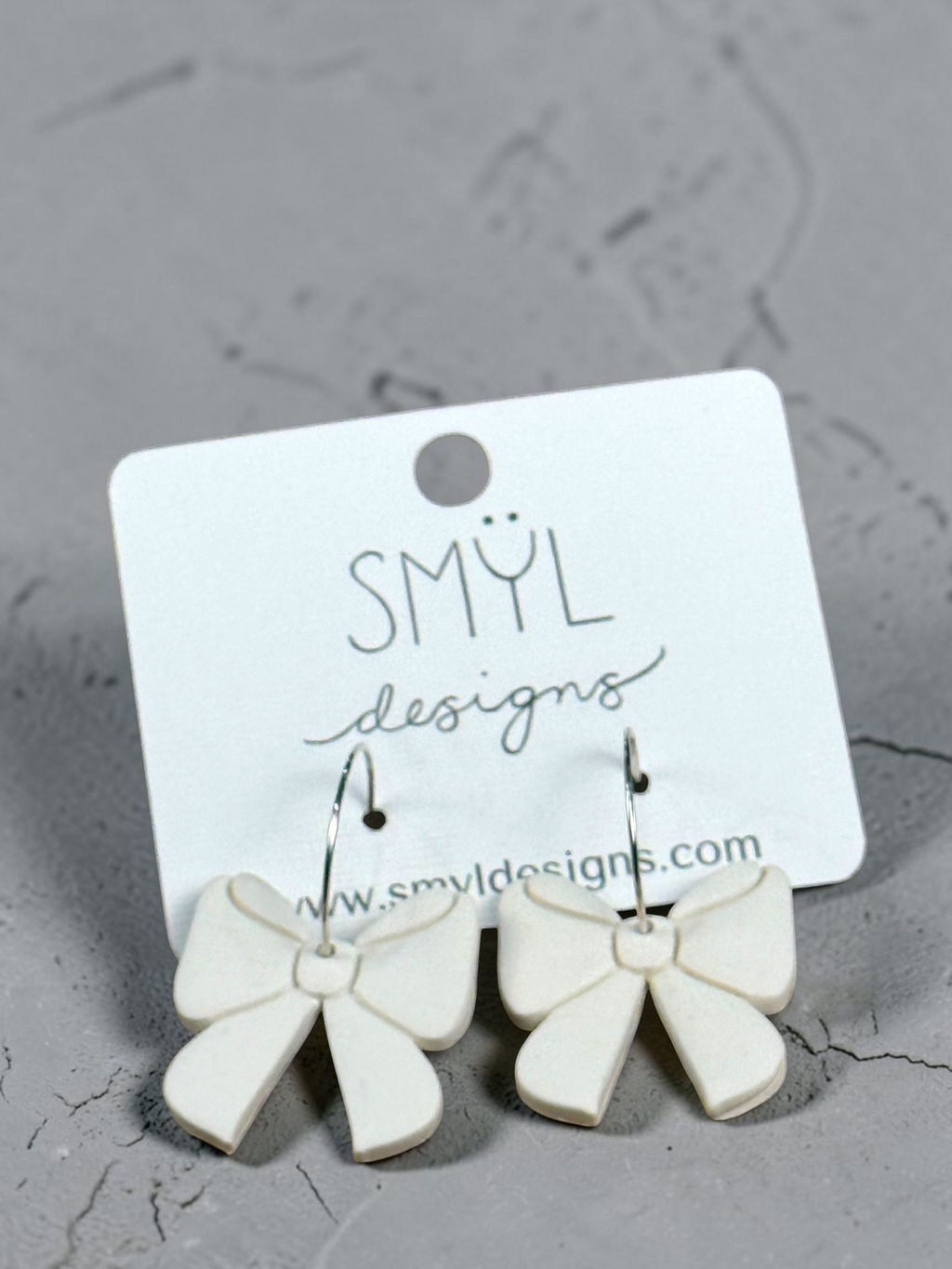 White large-bow hoop earrings