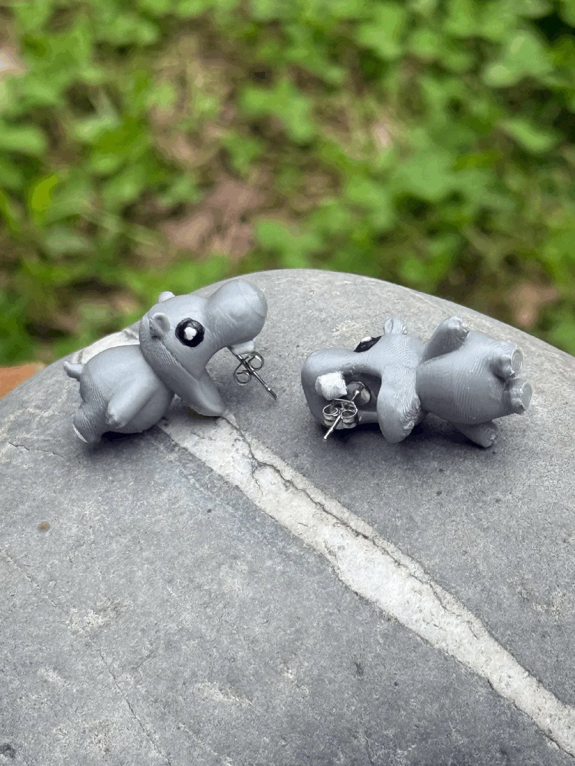 Close-up detail of chomping hippo earrings
